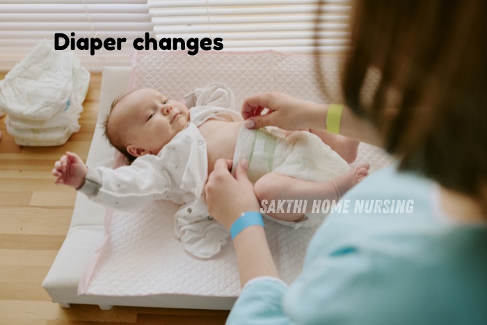 Sakthi Home Nursing in Coimbatore gently changing a baby’s diaper, ensuring hygienic and comfortable infant care at home