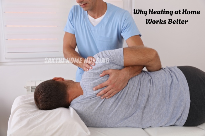 Professional male physiotherapist from Sakthi Home Nursing in Coimbatore therapeutic back treatment for a male patient at home care